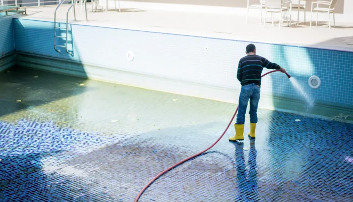 man-cleaning-pool